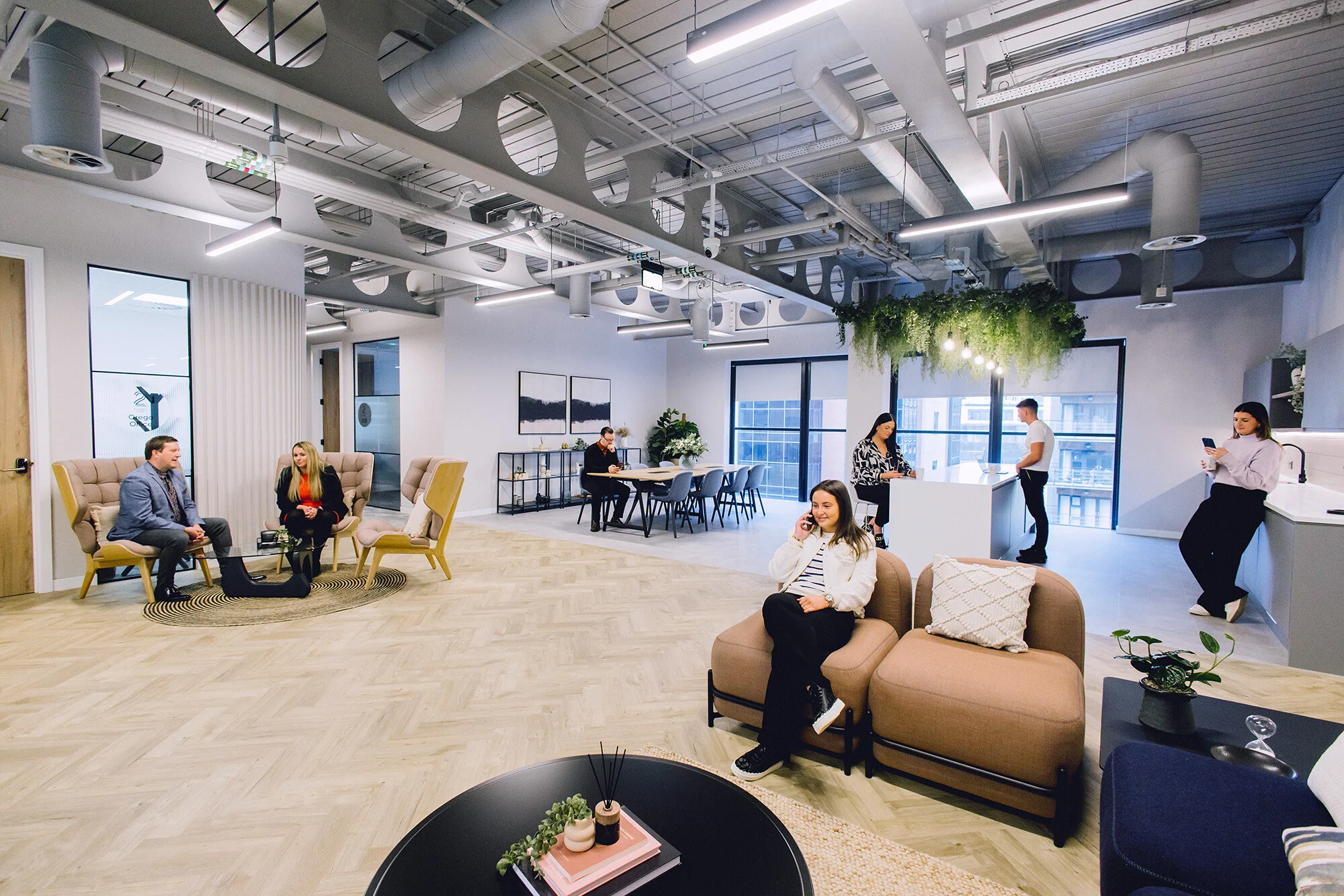 Colleagues participating in a coordinated group break session in an open office space
